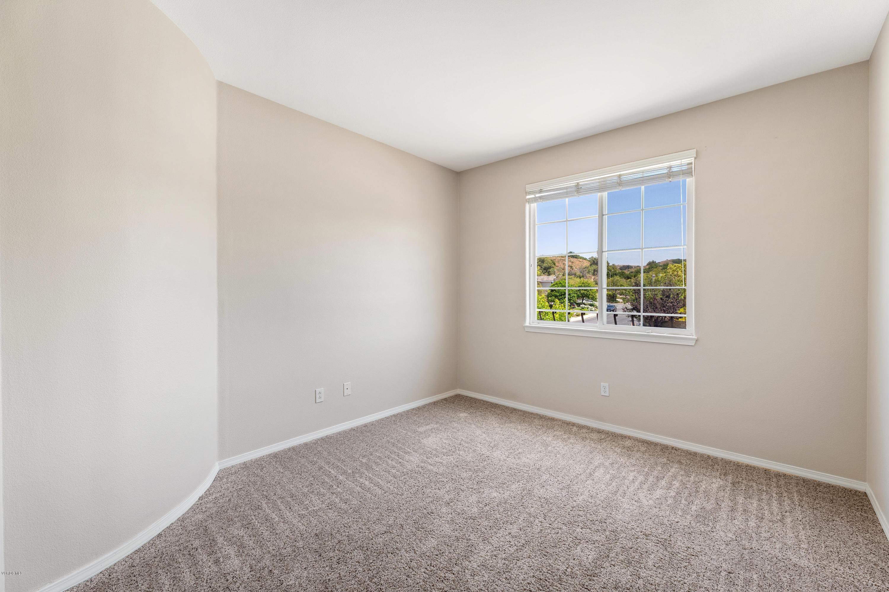 4591 Bluewood Court Moorpark, CA 93021 - Photo 21 of 43 an empty room with windows