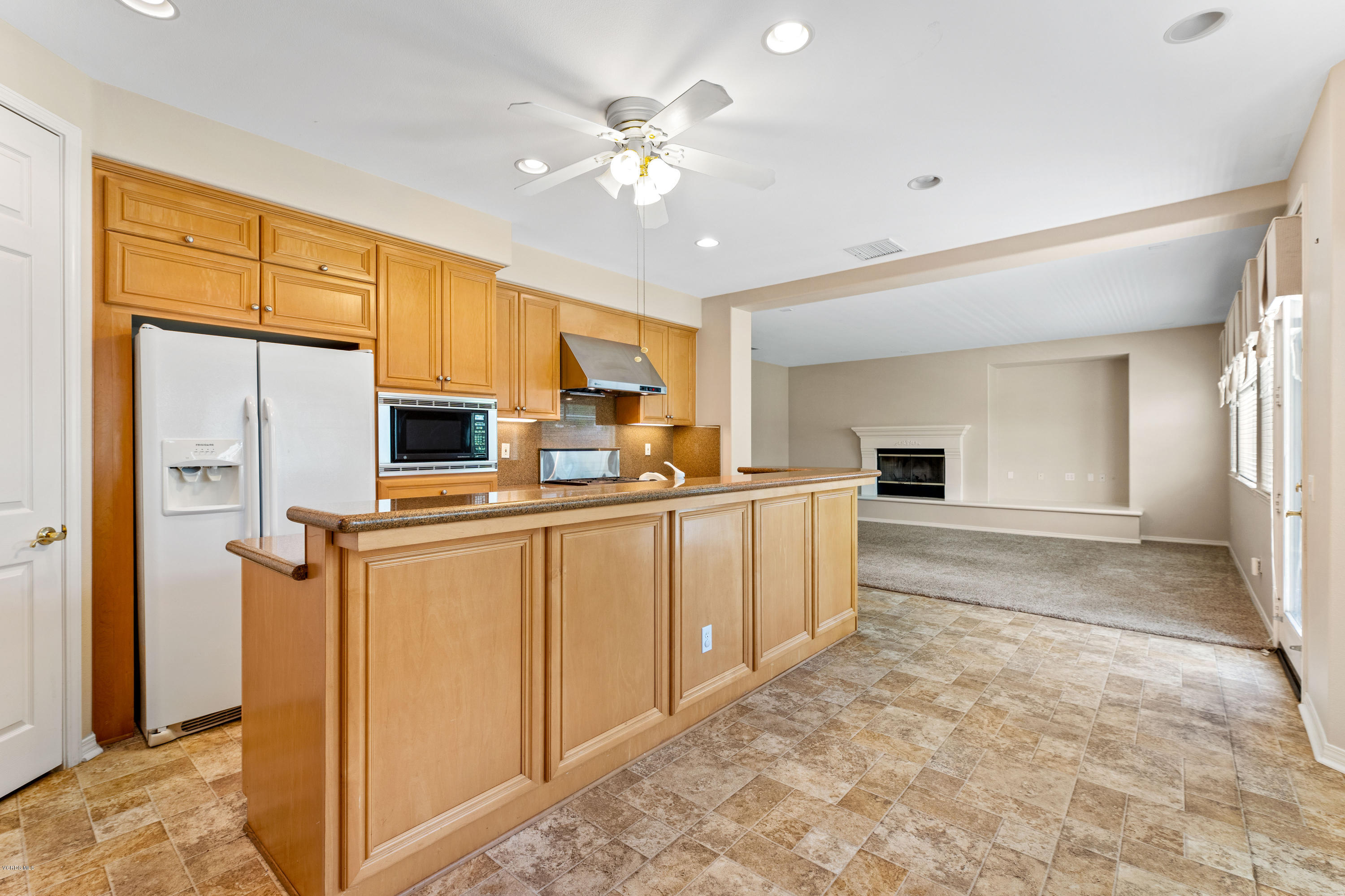 4591 Bluewood Court Moorpark, CA 93021 - Photo 25 of 43 a kitchen with stainless steel appliances a refrigerator sink and cabinets