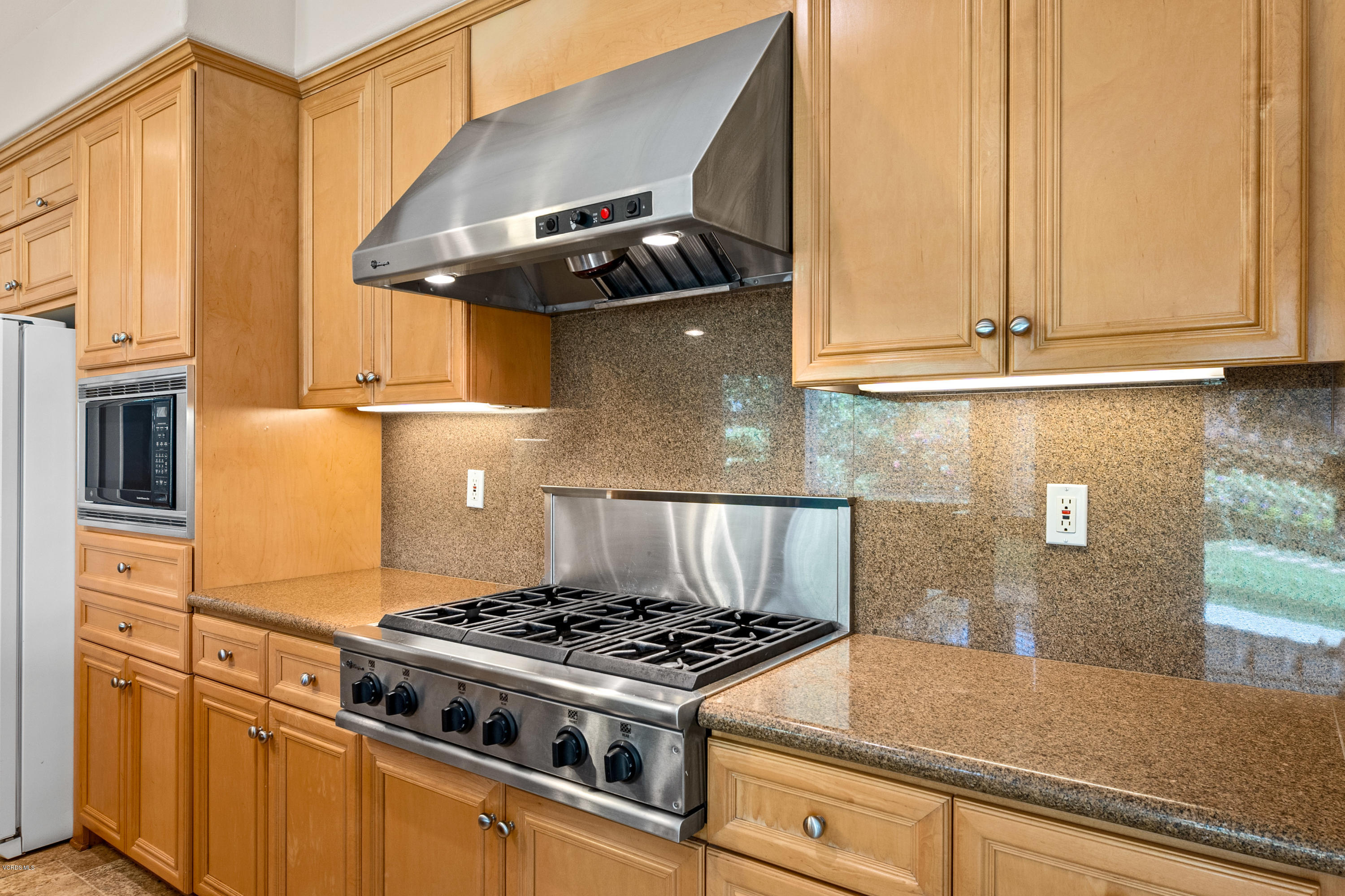4591 Bluewood Court Moorpark, CA 93021 - Photo 26 of 43 a stove top oven sitting inside of a kitchen