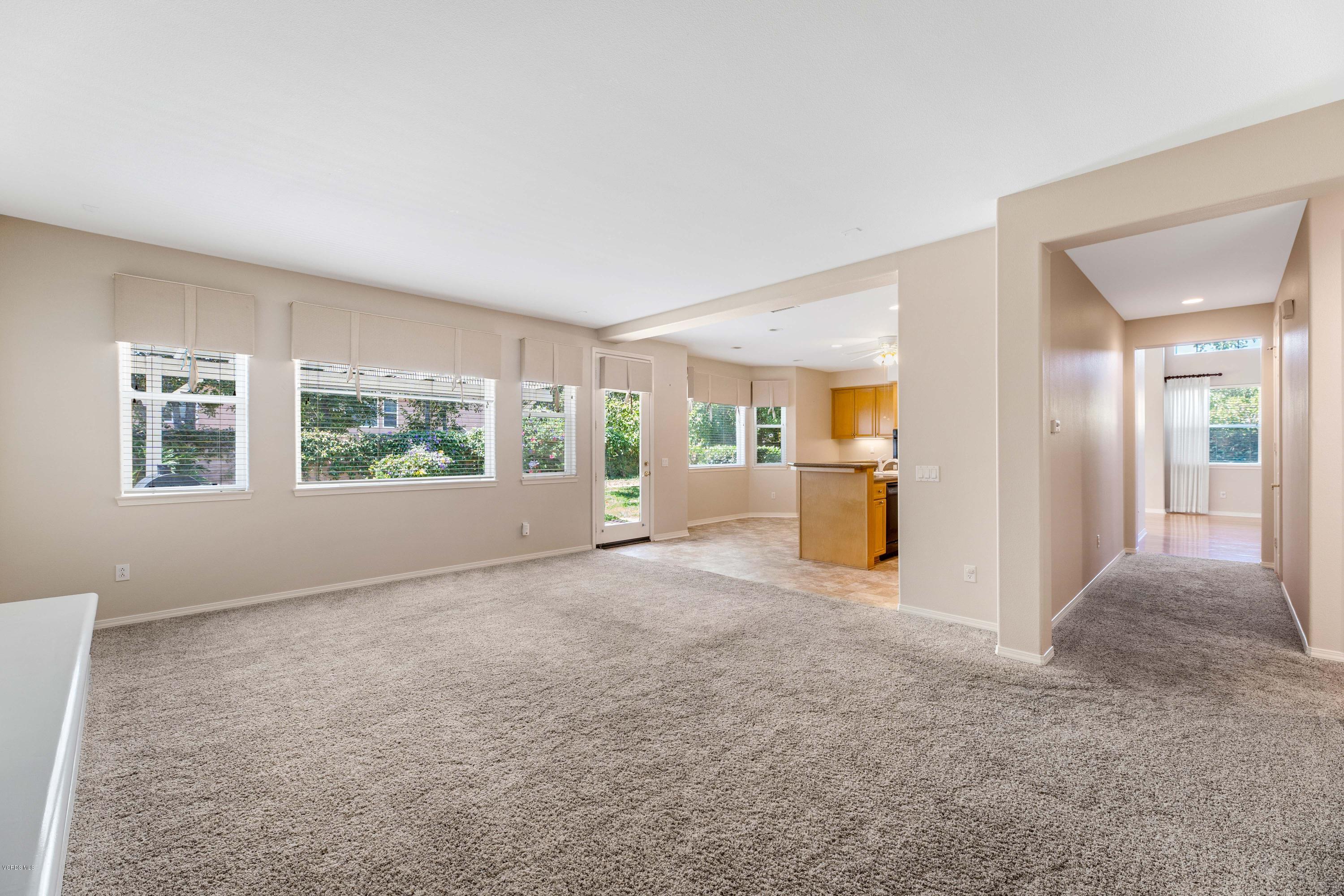 4591 Bluewood Court Moorpark, CA 93021 - Photo 29 of 43 a view of a big room with windows and refrigerator