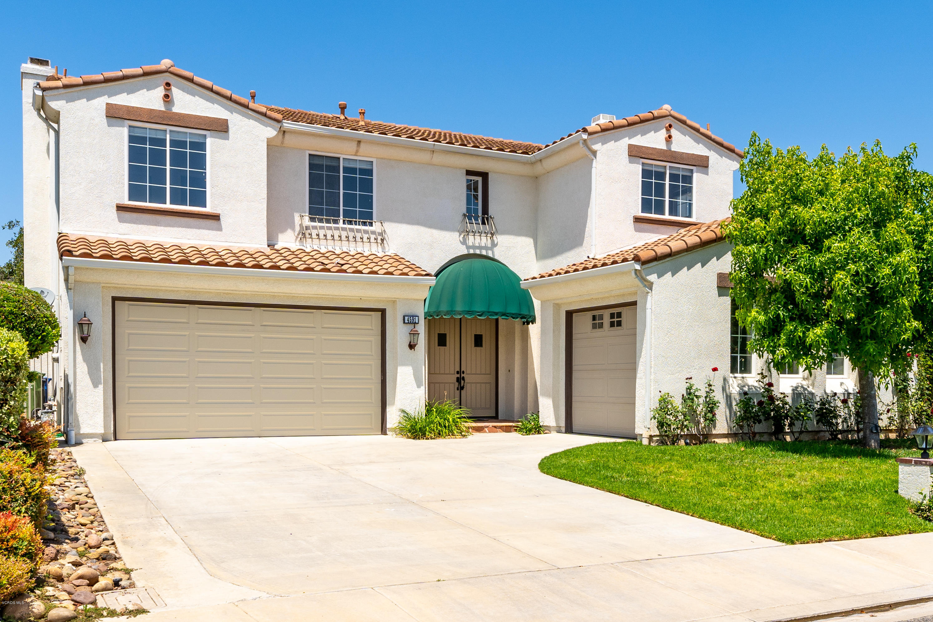 4591 Bluewood Court Moorpark, CA 93021 - Photo 34 of 43 a front view of a house with garden