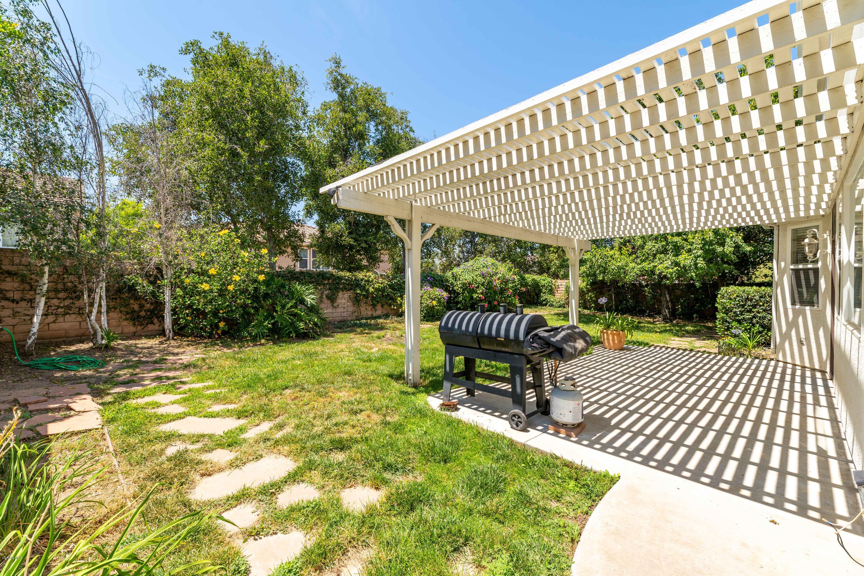 4591 Bluewood Court Moorpark, CA 93021 - Photo 38 of 43 a roof deck with table and chairs and potted plants