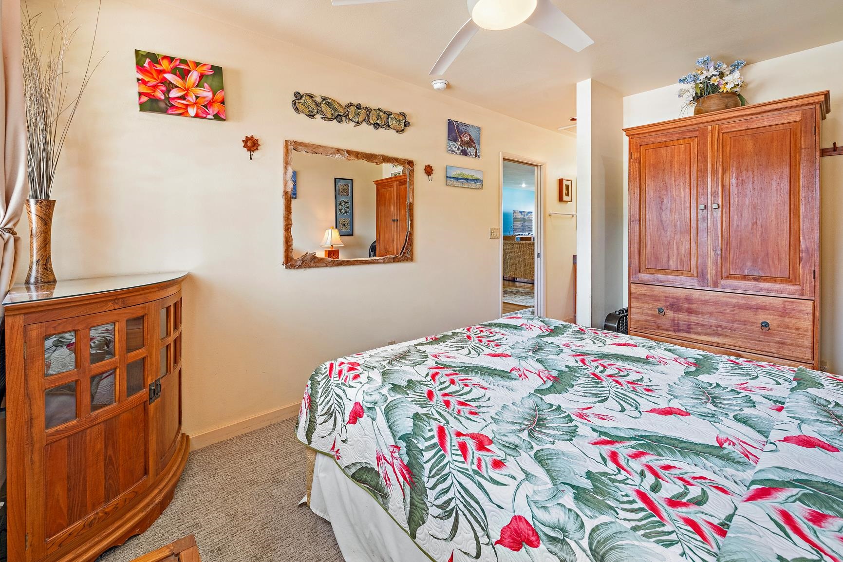 3559 Lower Honoapiilani Road, Unit 5G Lahaina, HI 96761 - Photo 24 of 42 a bedroom with a bed and a dresser
