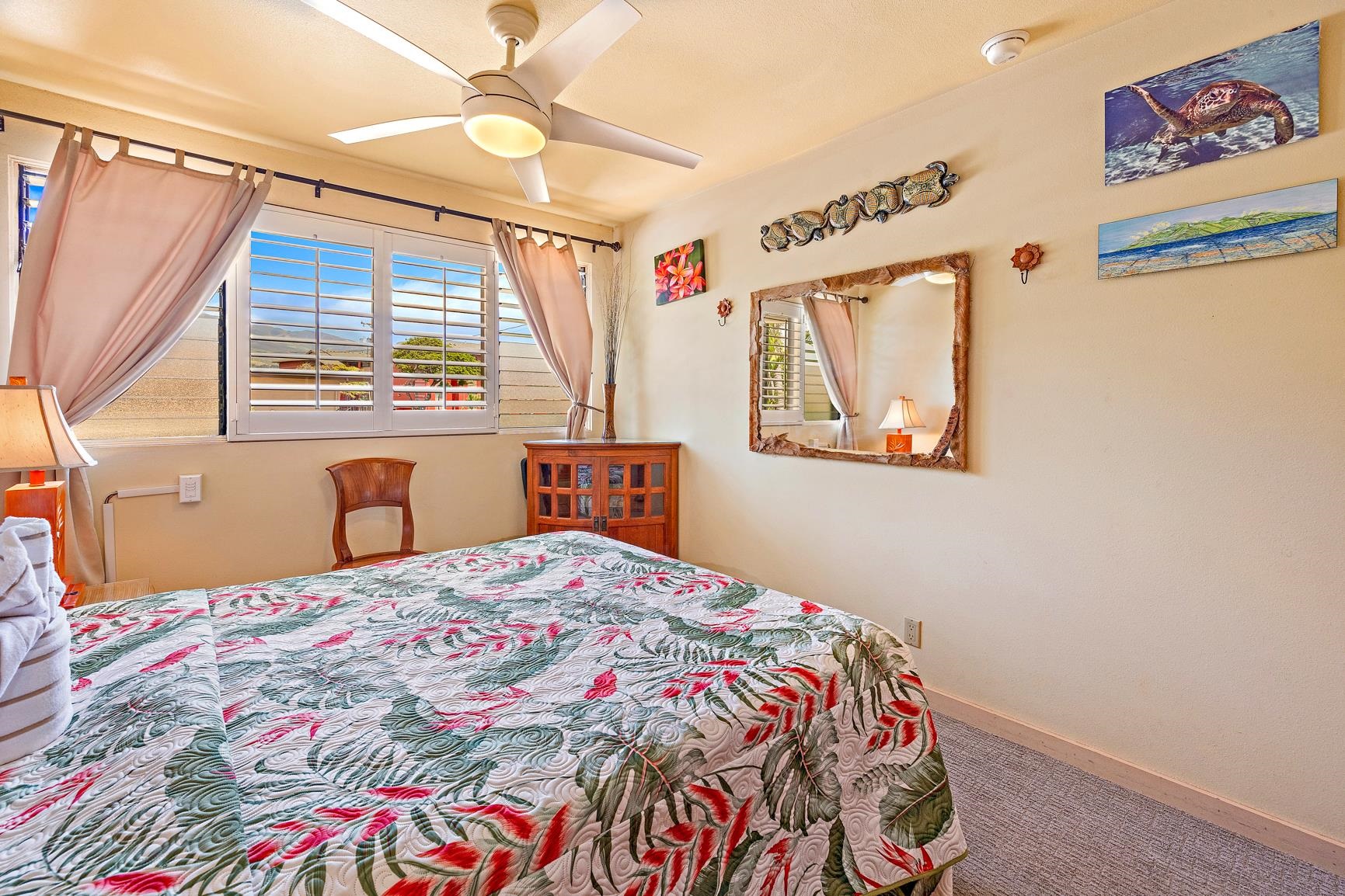 3559 Lower Honoapiilani Road, Unit 5G Lahaina, HI 96761 - Photo 26 of 42 a bedroom with a bed and a window