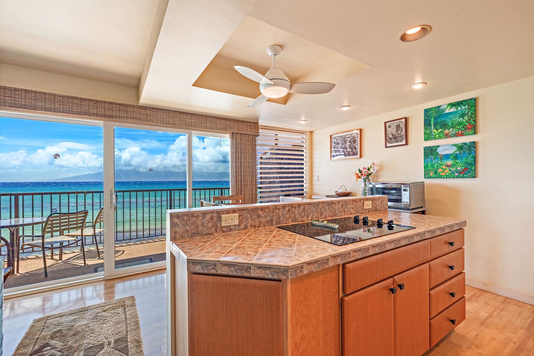 3559 Lower Honoapiilani Road, Unit 5G Lahaina, HI 96761 - Photo 4 of 42 a kitchen with a stove a sink and a refrigerator