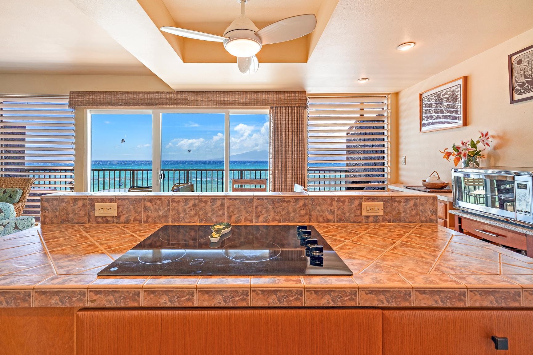 3559 Lower Honoapiilani Road, Unit 5G Lahaina, HI 96761 - Photo 6 of 42 a living room filled with lots of furniture and a large window