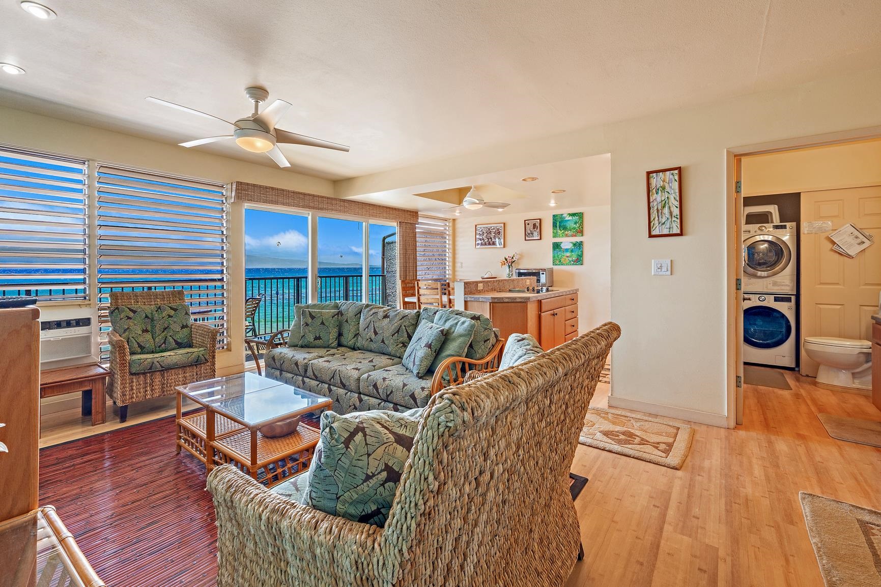 3559 Lower Honoapiilani Road, Unit 5G Lahaina, HI 96761 - Photo 7 of 42 a living room with furniture and wooden floor