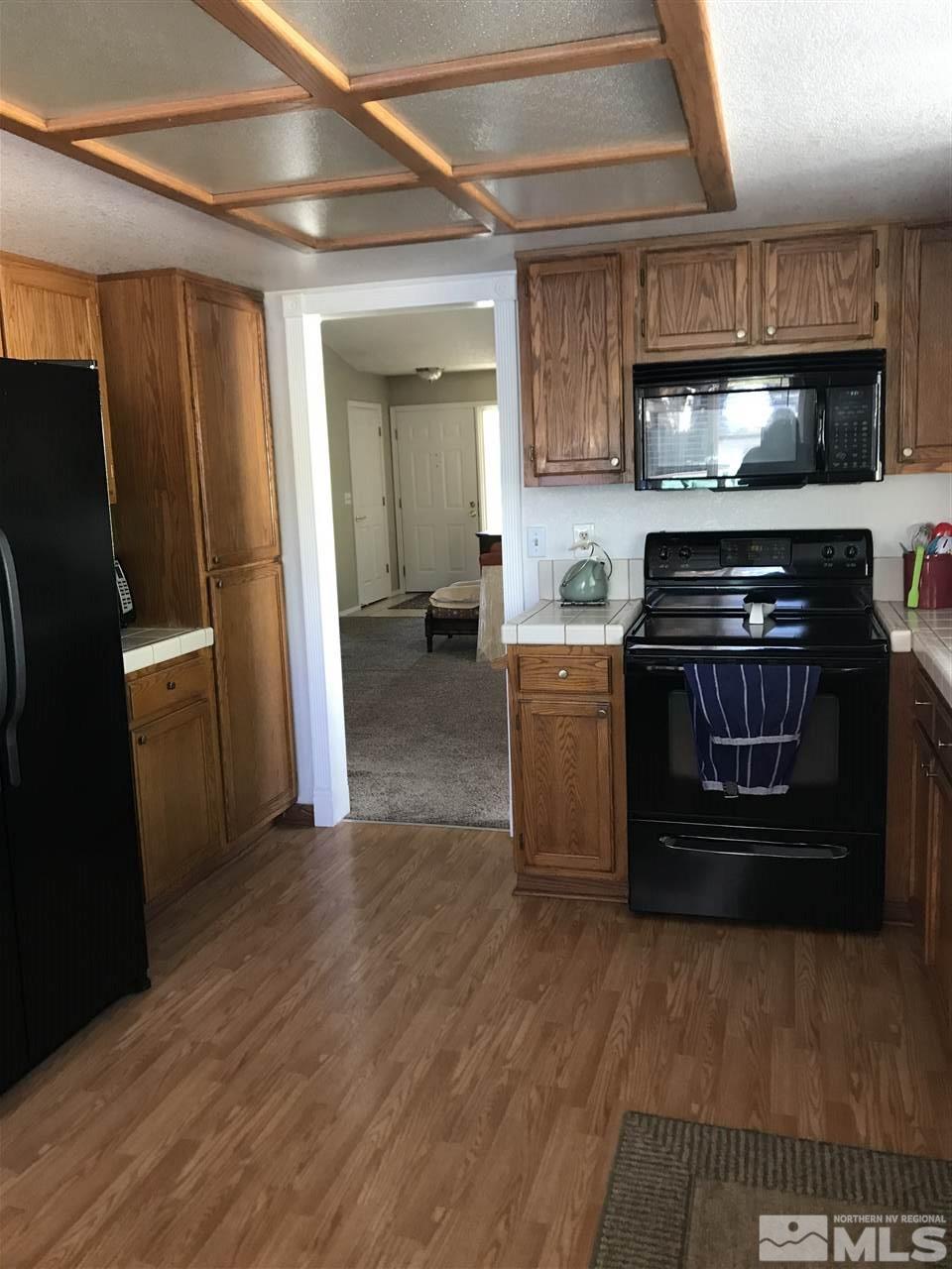 5305 Vista Ridge Way Reno, NV 89523 - Photo 6 of 11 a kitchen with a stove and a refrigerator