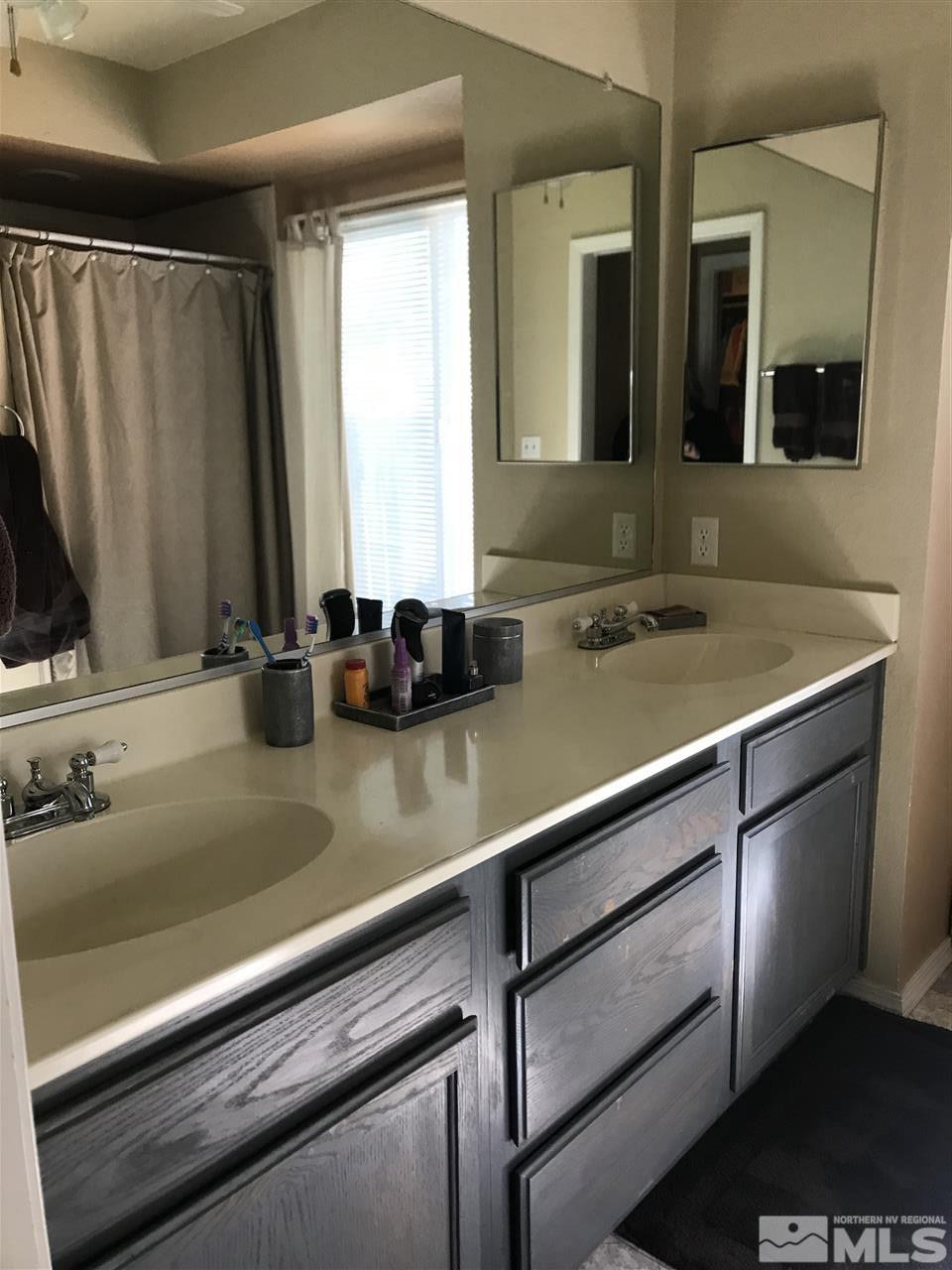 5305 Vista Ridge Way Reno, NV 89523 - Photo 10 of 11 a bathroom with a sink and a mirror