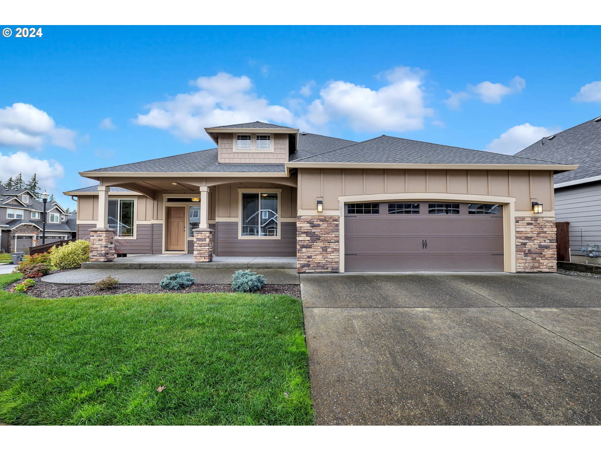 1859 South 51st Place Ridgefield, WA 98642 - Photo 1 of 1 a front view of a house with a yard and garage