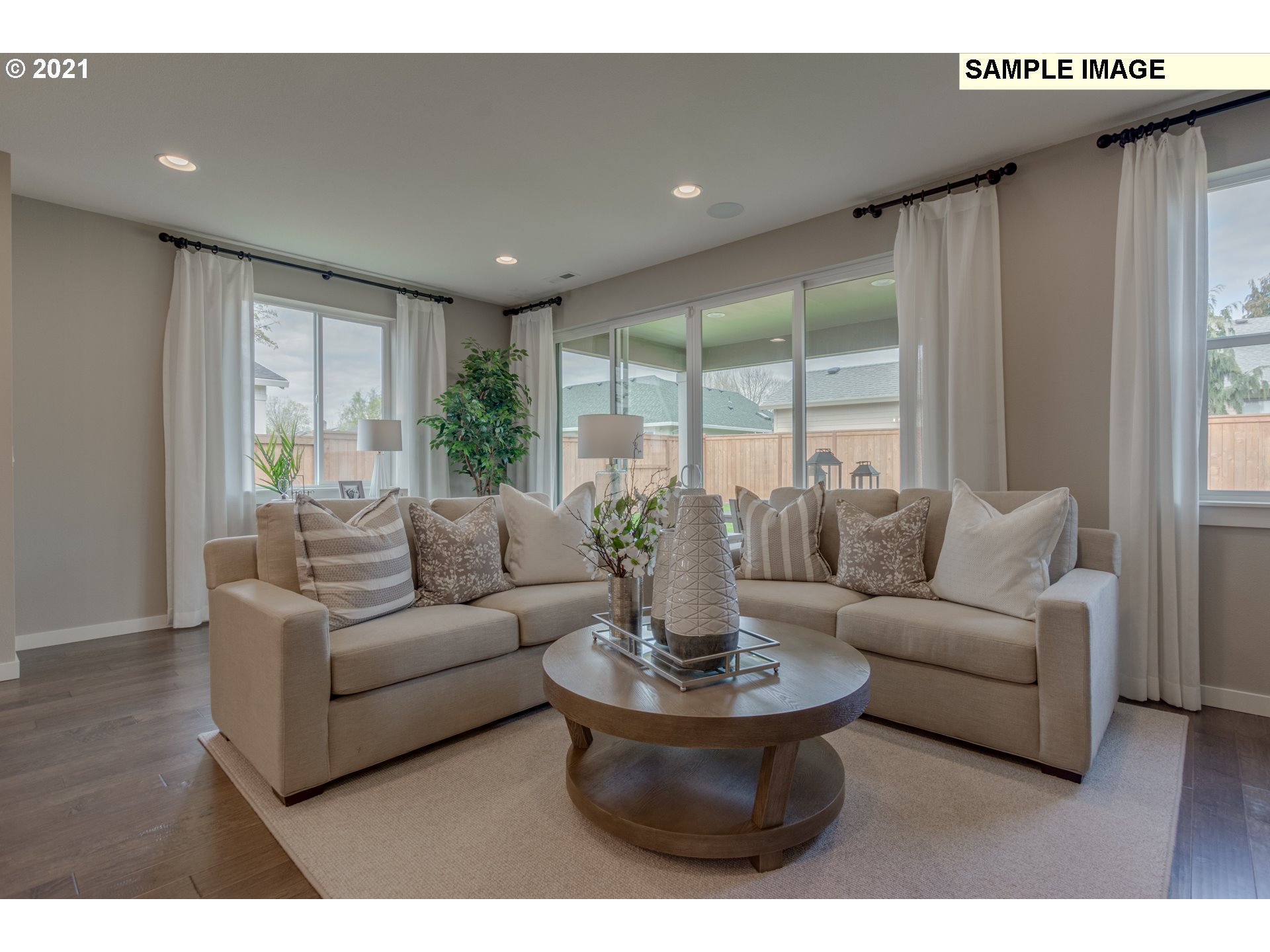 3111 North Mccanta Way Ridgefield, WA 98642 - Photo 4 of 12 a living room with furniture and a large window