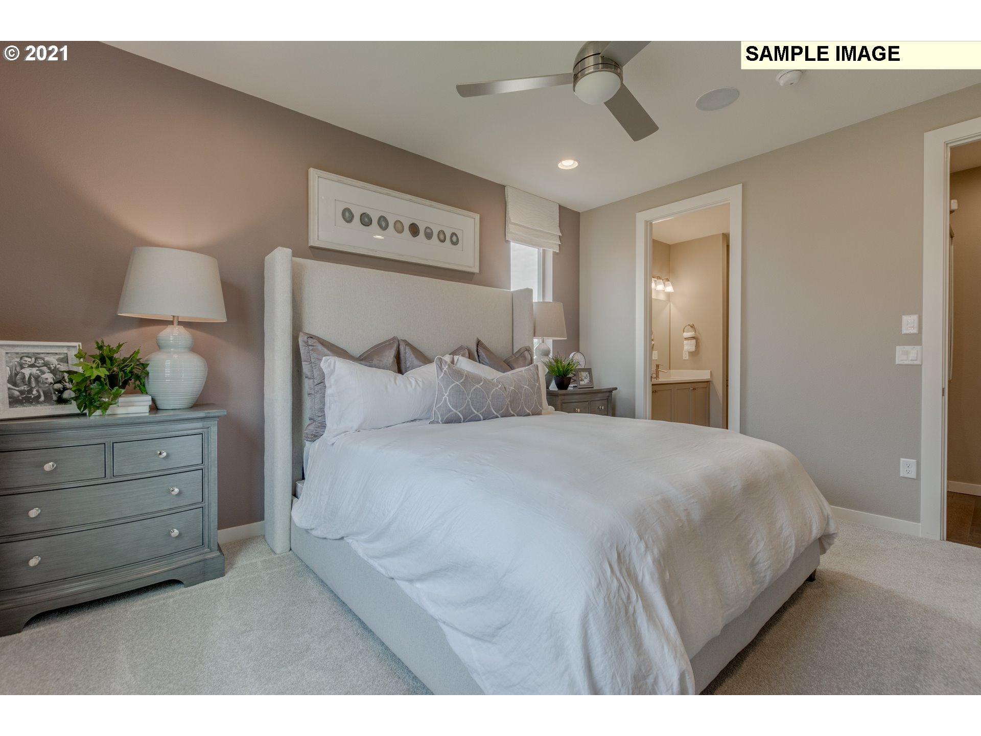 3111 North Mccanta Way Ridgefield, WA 98642 - Photo 6 of 12 a bedroom with a bed and a potted plant