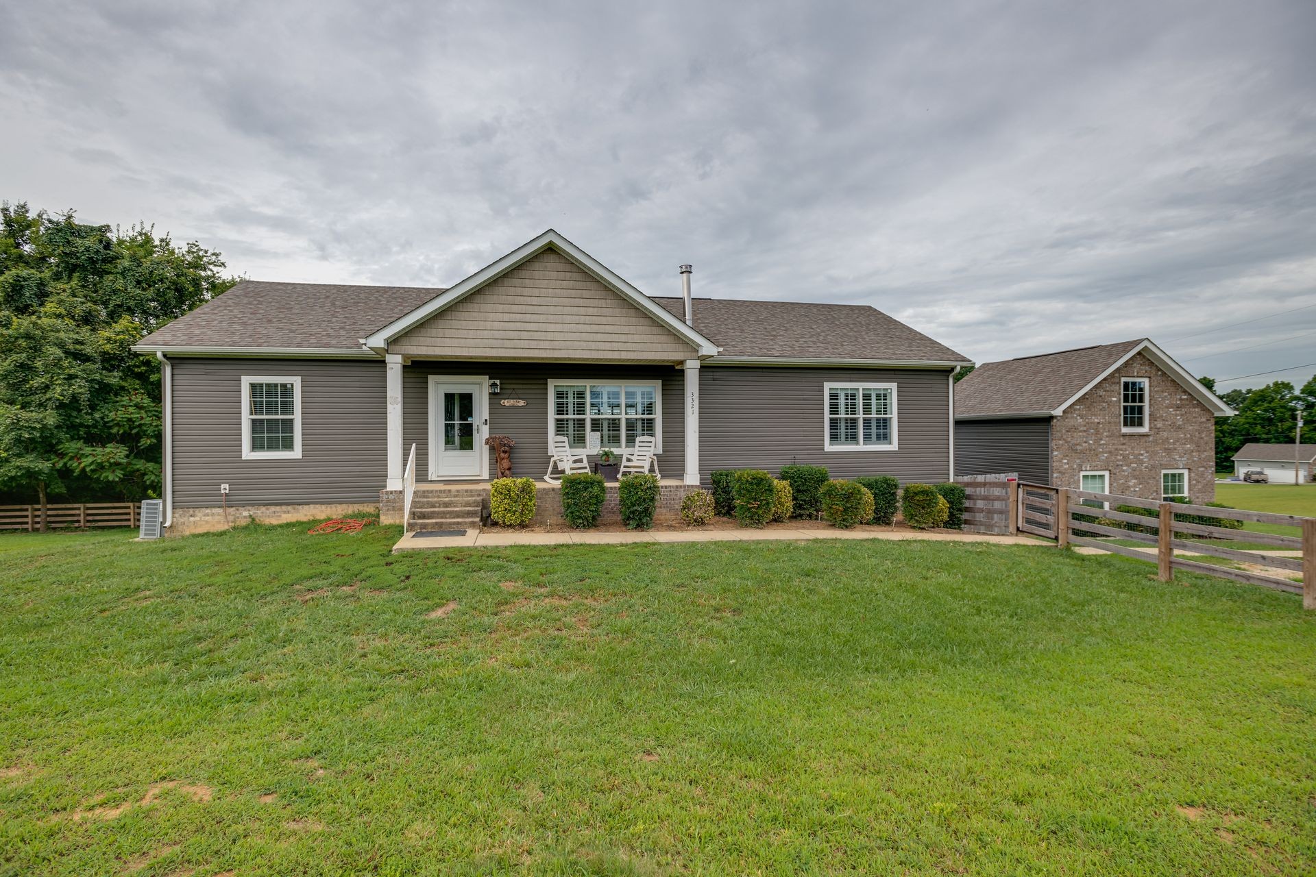 3321 Mahlon Moore Road Spring Hill, TN 37174 - Photo 1 of 22 a front view of a house with swimming pool having outdoor seating