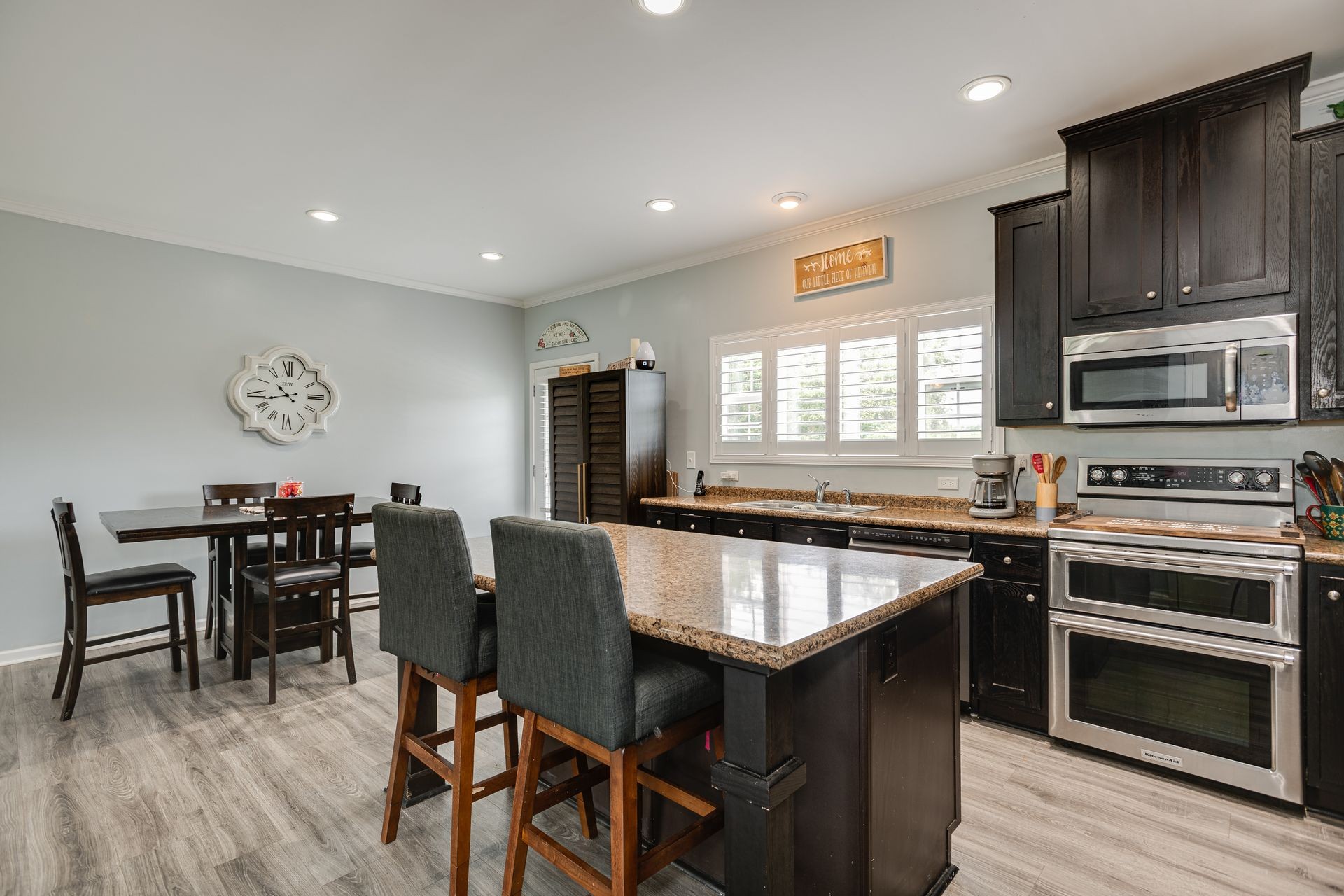 3321 Mahlon Moore Road Spring Hill, TN 37174 - Photo 11 of 22 a dining table with chairs and wooden floor