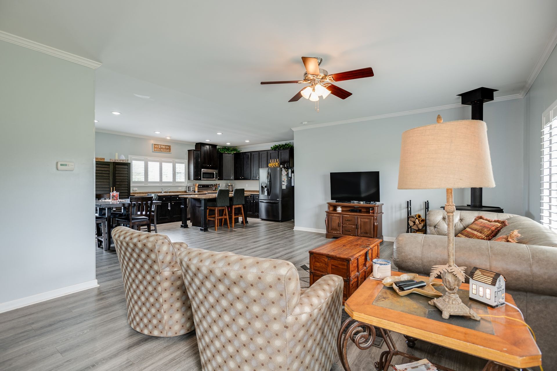 3321 Mahlon Moore Road Spring Hill, TN 37174 - Photo 8 of 22 a living room with furniture kitchen view and a fireplace