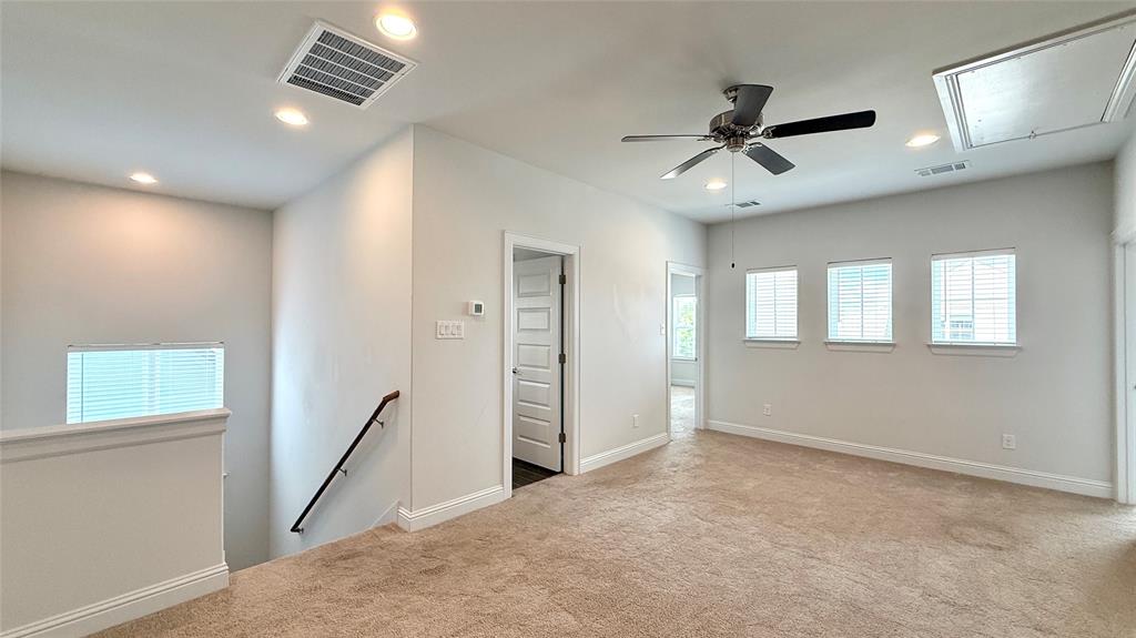601 C-Bar Ranch Trail, Unit 27 Cedar Park, TX 78613 - Photo 21 of 29 Spacious upstairs loft featuring neutral carpeting and light wall tones