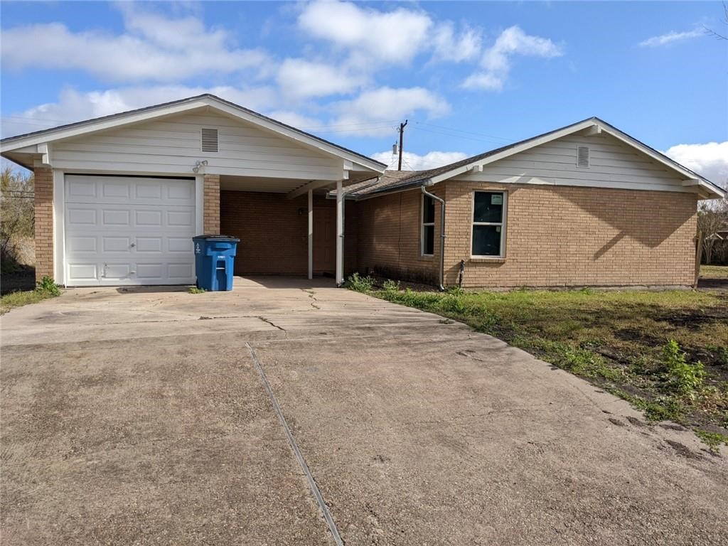 124 Redwood Drive Mathis, TX 78368 - Photo 2 of 10 a front view of a house with yard