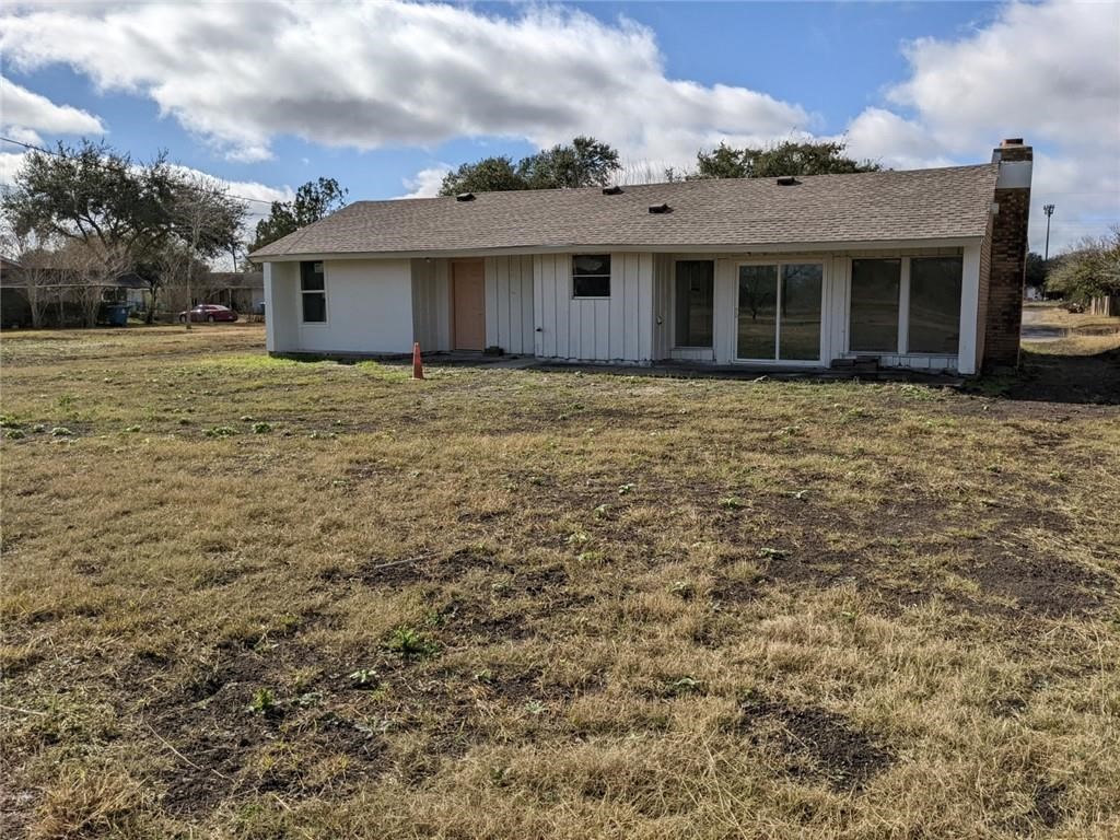 124 Redwood Drive Mathis, TX 78368 - Photo 3 of 10 a front view of a house with a garden