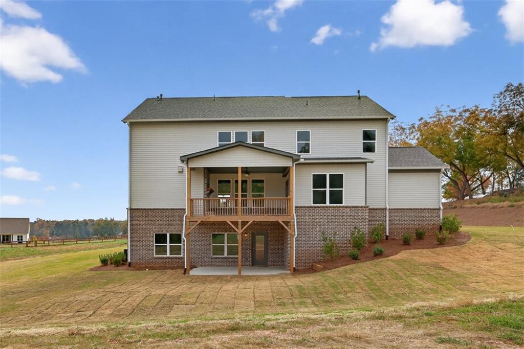 8845 Jot Em Down Road Gainesville, GA 30506 - Photo 70 of 87 a front view of a house with a yard