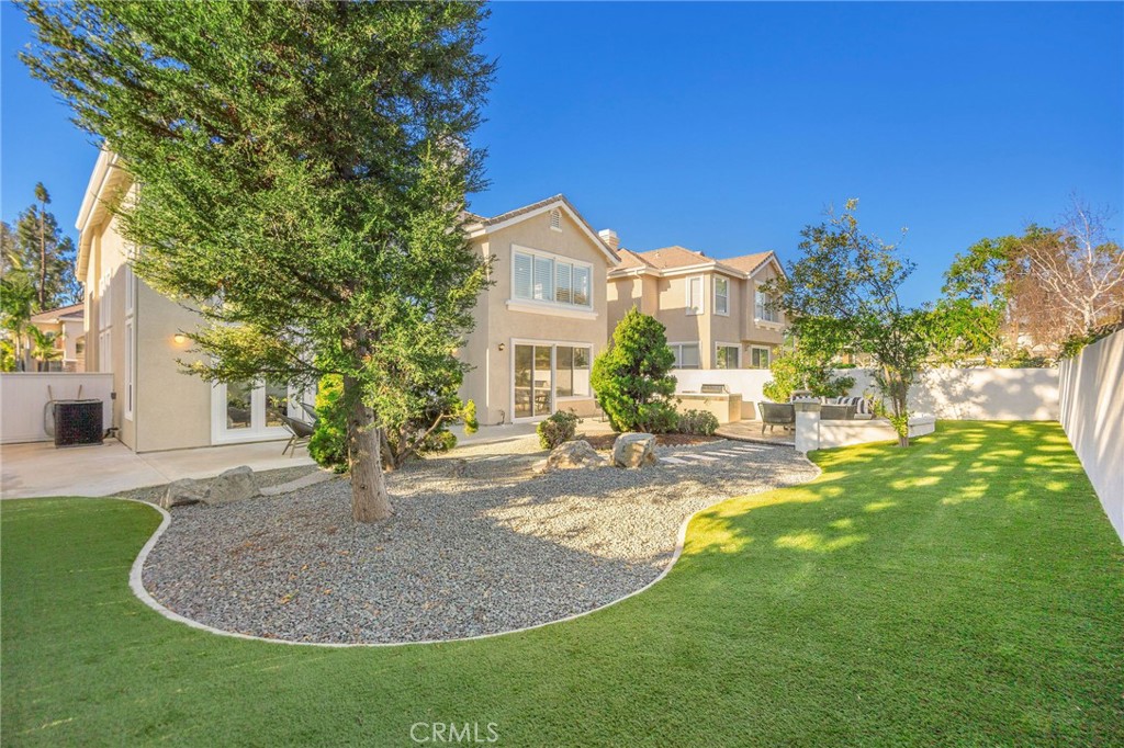 6 Broadleaf Irvine, CA 92612 - Photo 16 of 46 a view of a house with a backyard