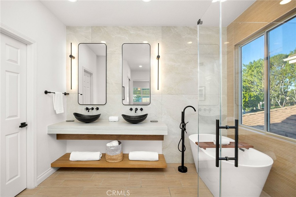 6 Broadleaf Irvine, CA 92612 - Photo 25 of 46 a bathroom with double vanity sinks and a mirror