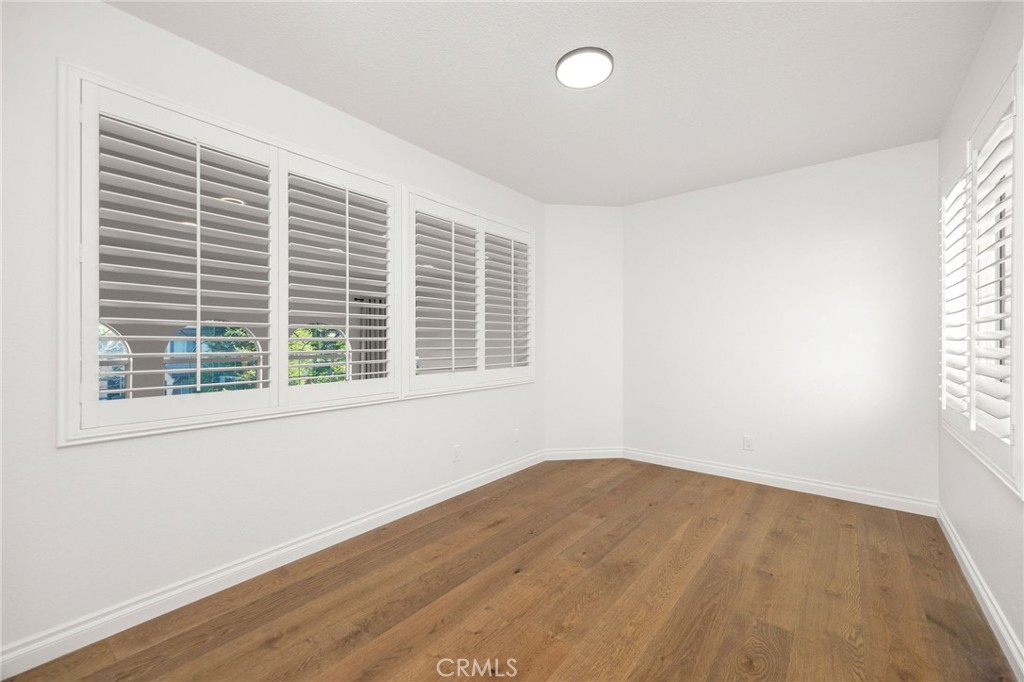 6 Broadleaf Irvine, CA 92612 - Photo 28 of 46 a view of empty room with wooden floor and fan
