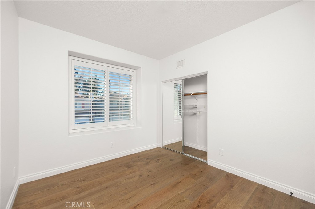 6 Broadleaf Irvine, CA 92612 - Photo 30 of 46 a view of an empty room with wooden floor and a window