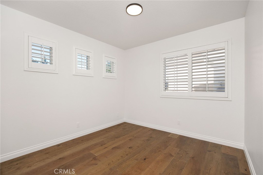 6 Broadleaf Irvine, CA 92612 - Photo 35 of 46 an empty room with wooden floor and windows