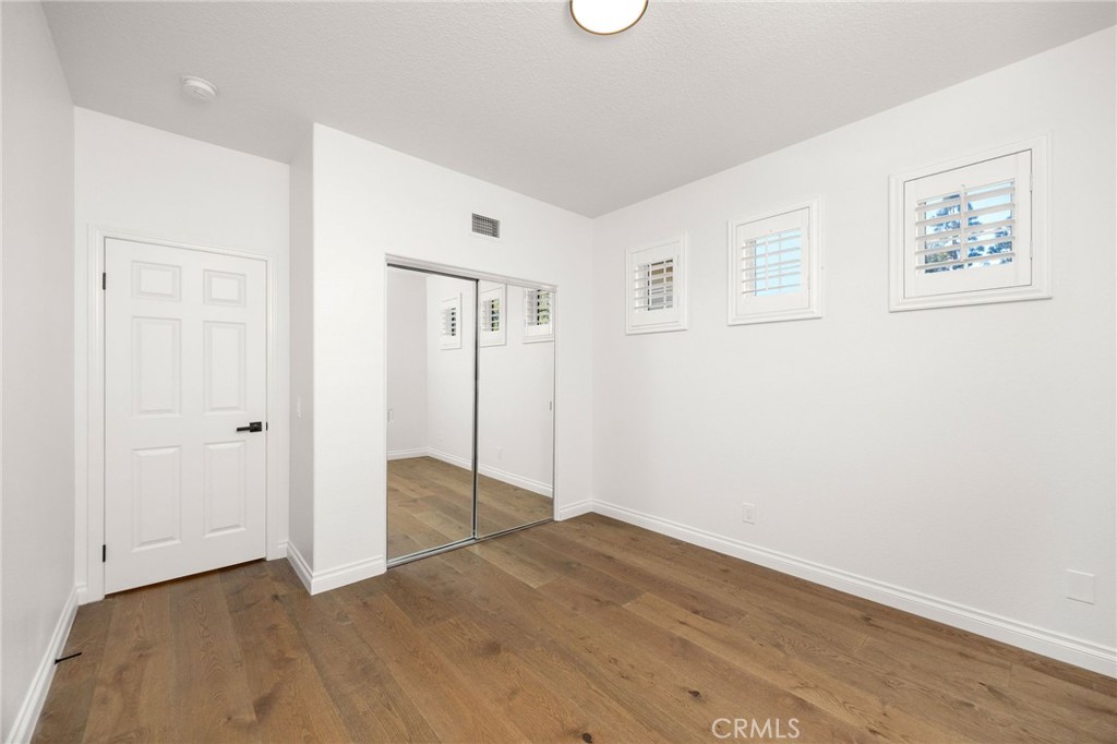 6 Broadleaf Irvine, CA 92612 - Photo 36 of 46 an empty room with wooden floor and window