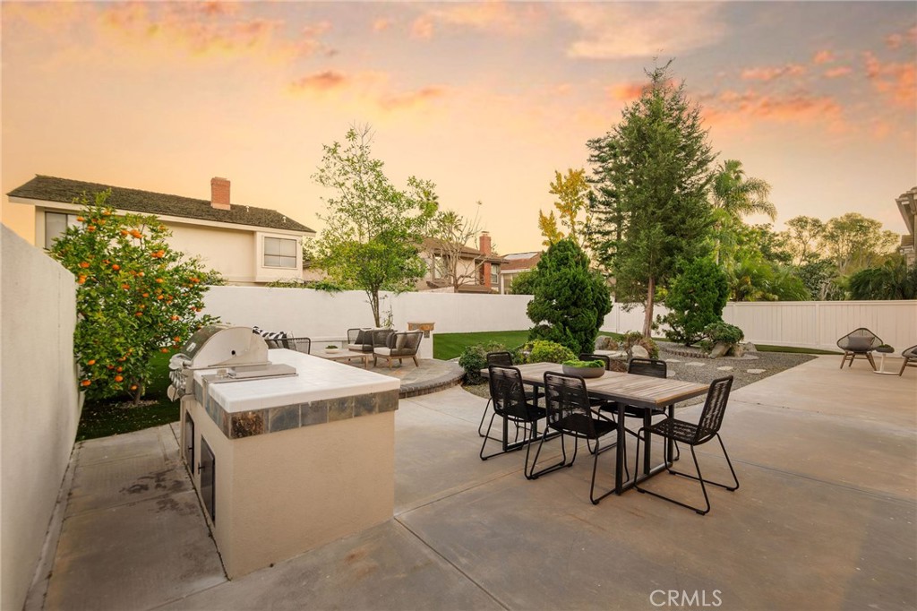 6 Broadleaf Irvine, CA 92612 - Photo 39 of 46 a patio with table and chairs and potted plants
