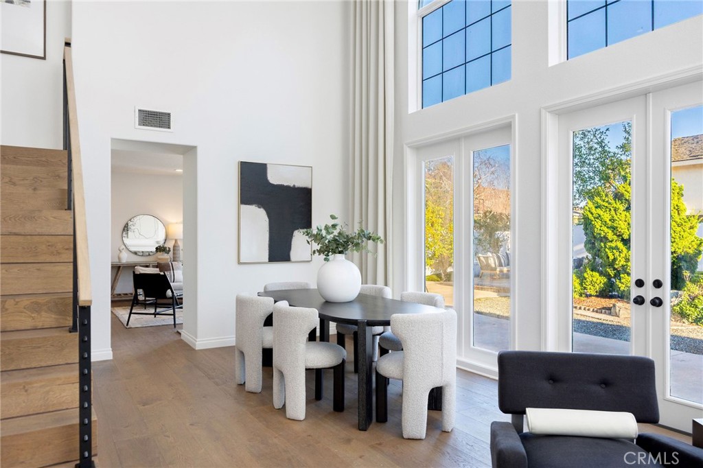 6 Broadleaf Irvine, CA 92612 - Photo 6 of 46 a living room with furniture a large window and potted plants