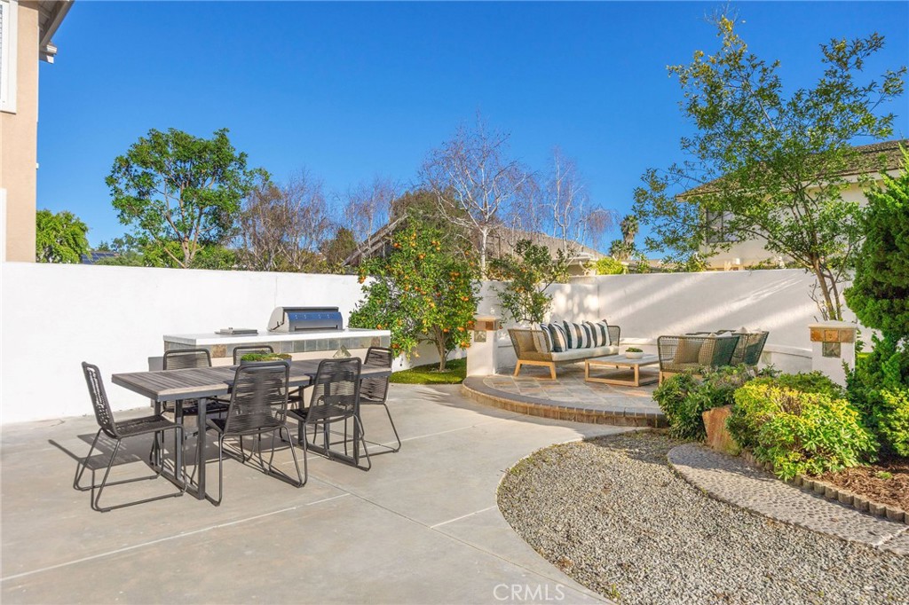 6 Broadleaf Irvine, CA 92612 - Photo 10 of 46 a view of a patio with table and chairs and potted plants