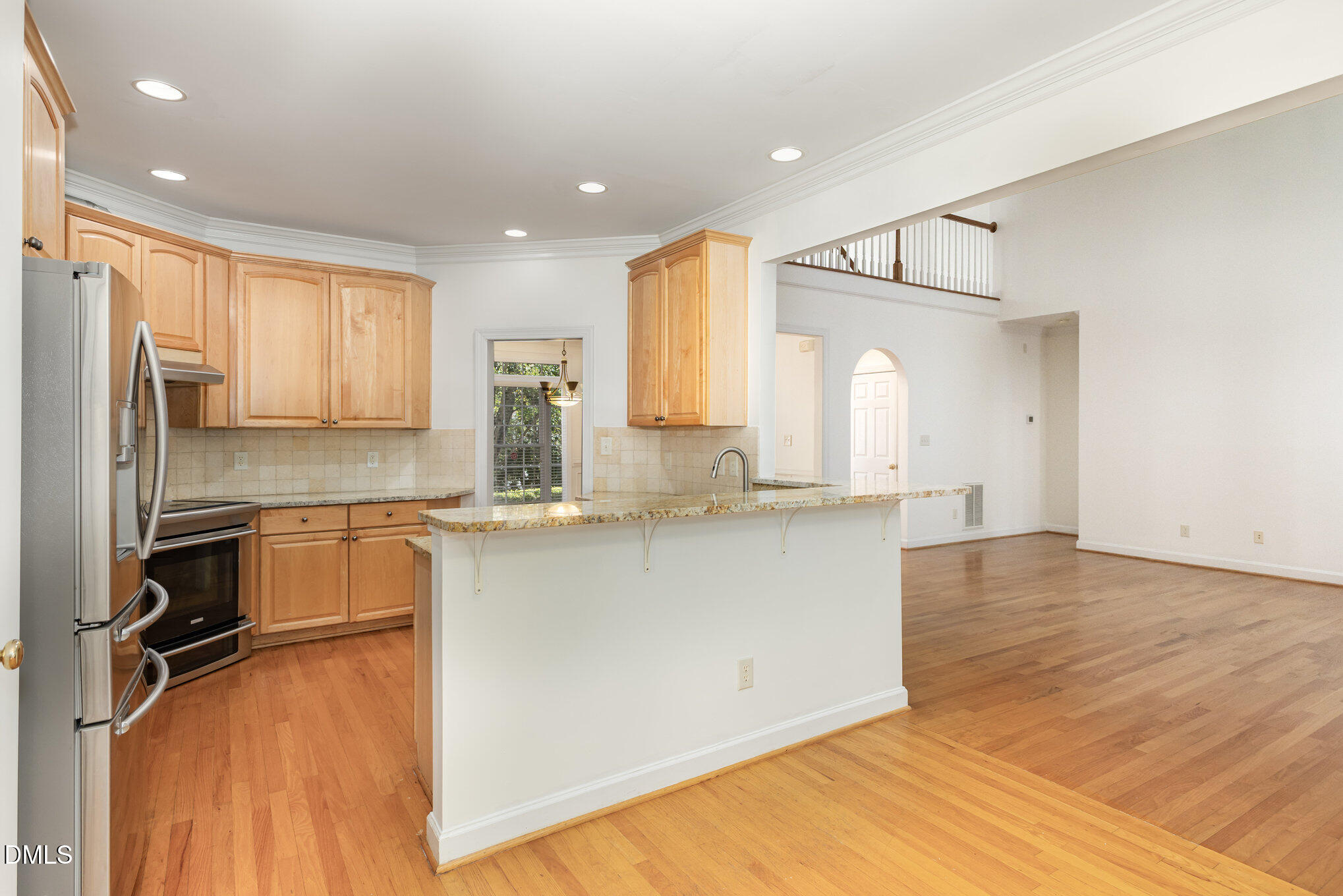 209 Manor Ridge Road Carrboro, NC 27510 - Photo 10 of 39 a kitchen with kitchen island a counter top space a sink stainless steel appliances and cabinets
