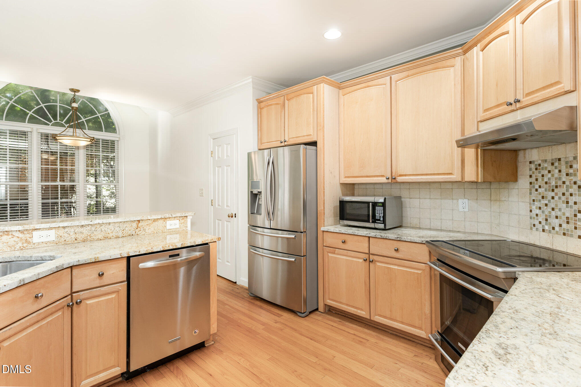 209 Manor Ridge Road Carrboro, NC 27510 - Photo 11 of 39 a kitchen with cabinets appliances and a window