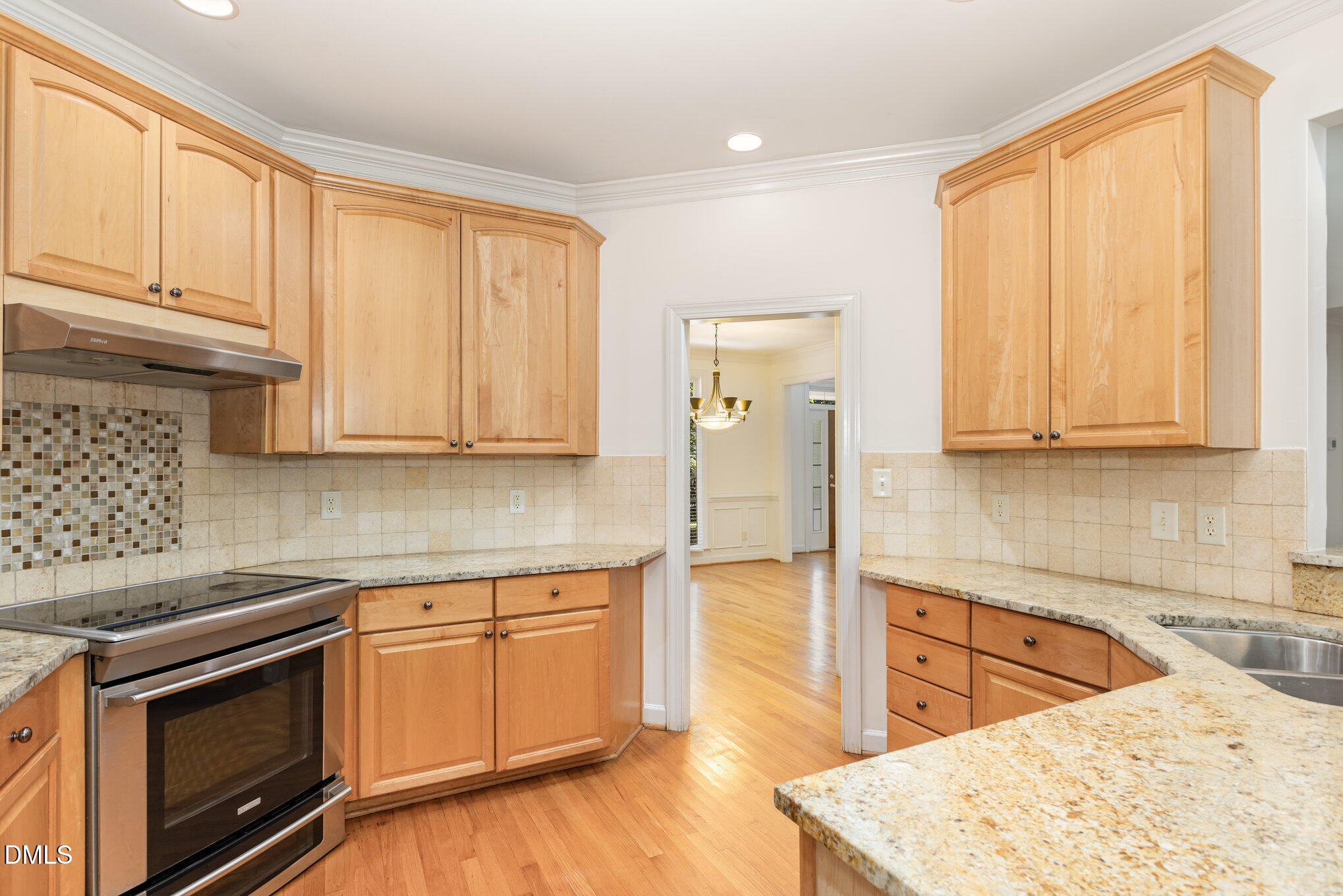 209 Manor Ridge Road Carrboro, NC 27510 - Photo 12 of 39 a kitchen with stainless steel appliances granite countertop a stove a sink and a microwave
