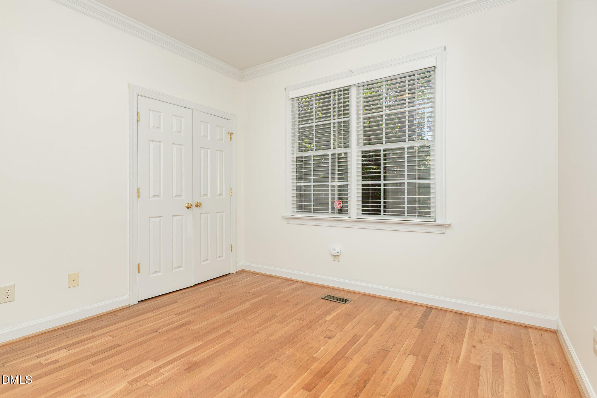 209 Manor Ridge Road Carrboro, NC 27510 - Photo 19 of 39 a view of empty room with wooden floor and fan