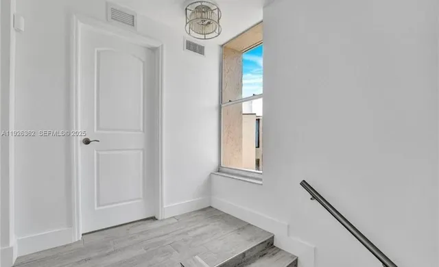 a view of an entryway with hallway