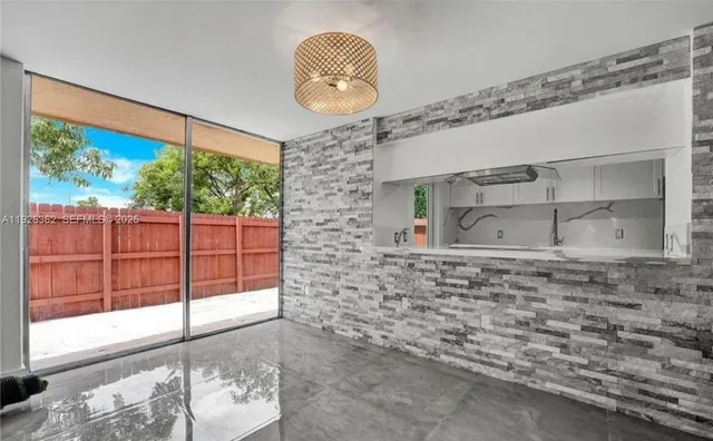 a view of a door and a window