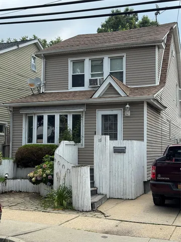 a front view of a house with garage