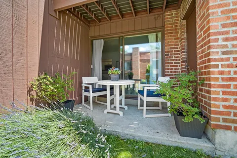a view of a backyard with sitting area