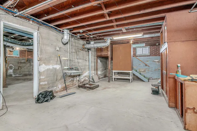 a view of an empty room with a fireplace