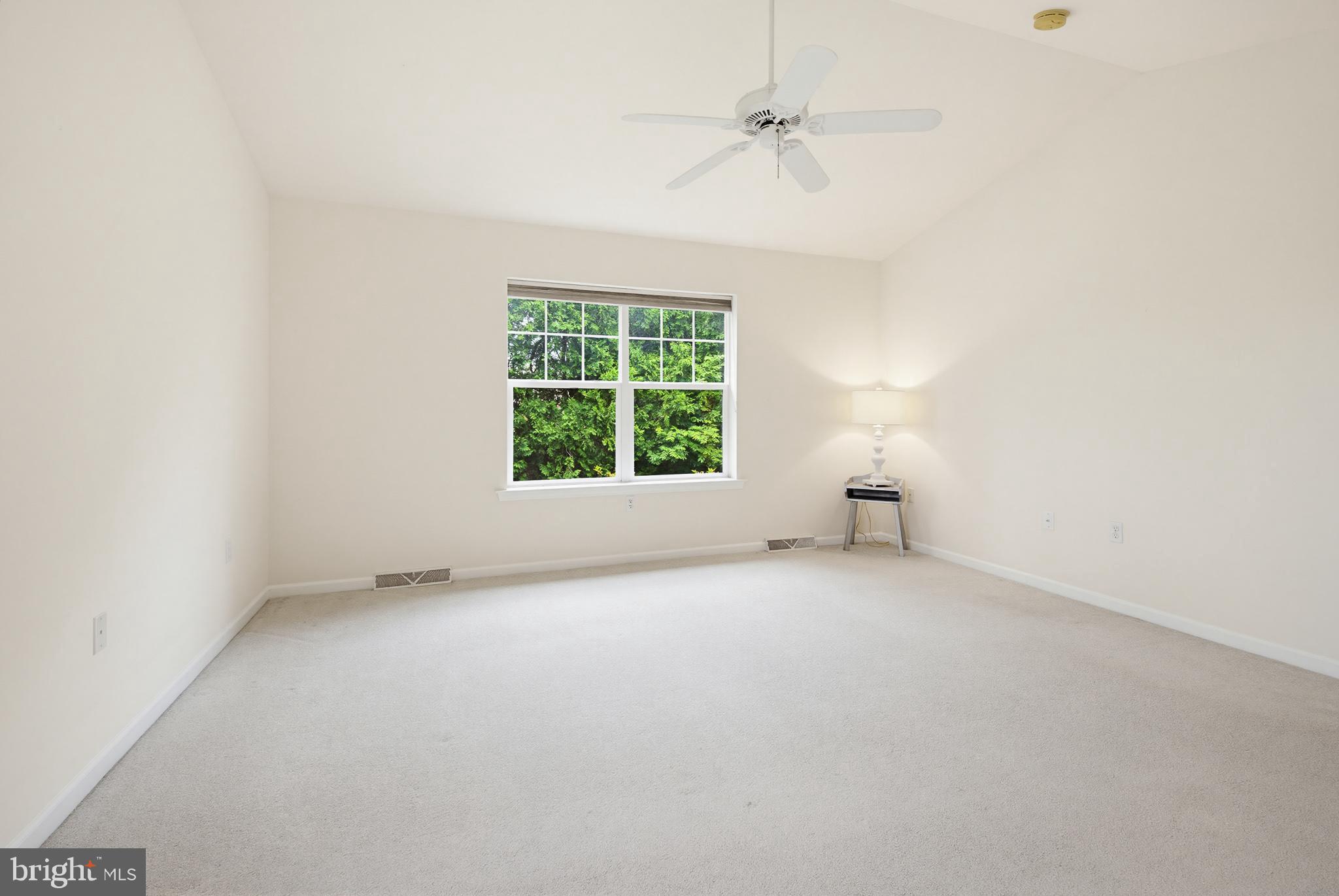 1037 Kent Garden Lititz, PA 17543 - Photo 25 of 31 an empty room with a window and a ceiling fan