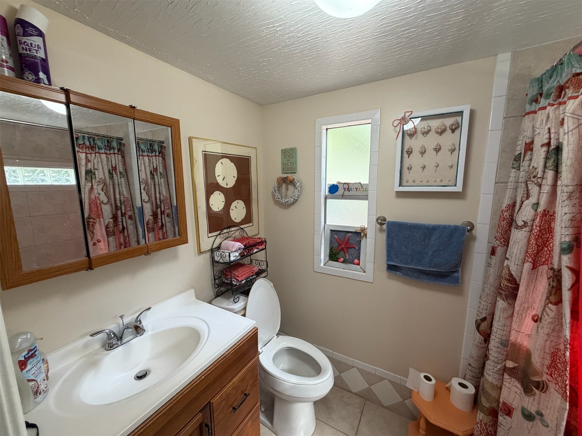 85045 Lonnie Crews Road Fernandina Beach, FL 32034 - Photo 22 of 28 a bathroom with a toilet sink and mirror