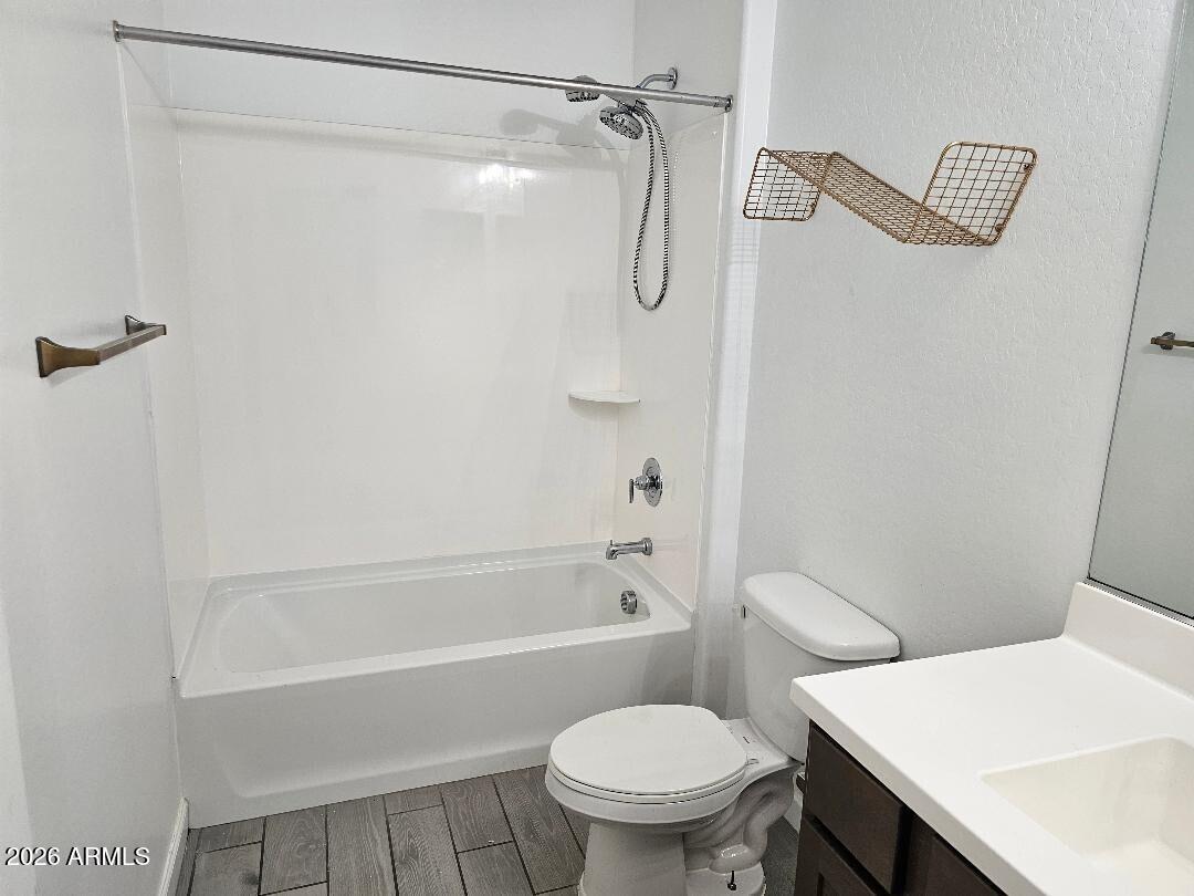 24151 West Ripple Road Buckeye, AZ 85326 - Photo 10 of 13 a white toilet sitting next to a bath tub