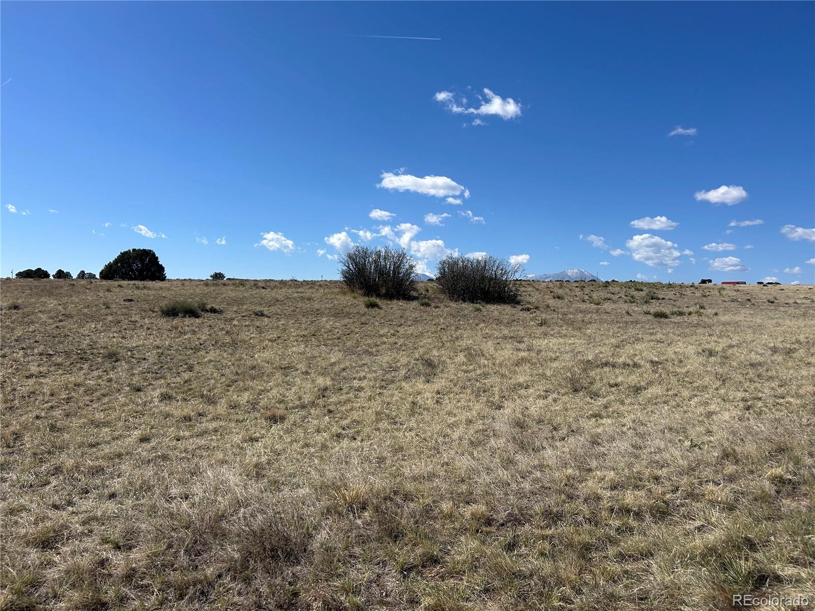 Lot 94 Navajo Ranch Walsenburg, CO 81089 - Photo 1 of 15 a view of a brick wall and a yard