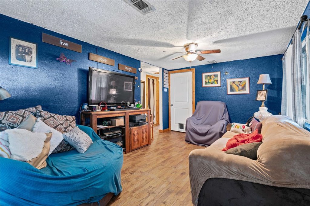250 Rick Road La Grange, TX 78945 - Photo 18 of 27 a living room with furniture and a flat screen tv