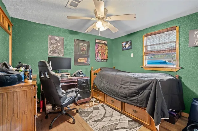 a bedroom with a workspace