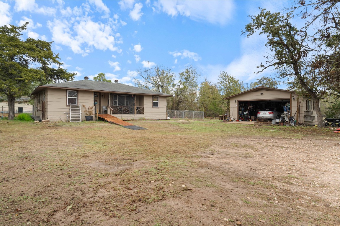 250 Rick Road La Grange, TX 78945 - Photo 3 of 27 a front view of a house with a yard and a garage