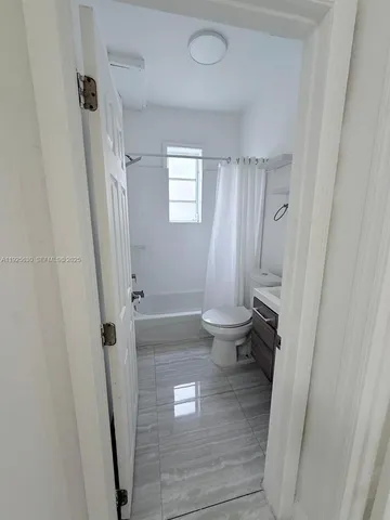 a bathroom with a sink and toilet