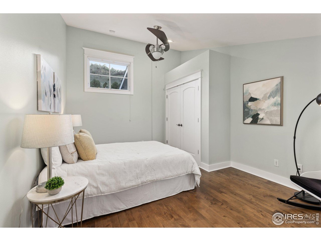 2942 4th Street Boulder, CO 80304 - Photo 22 of 40 a bedroom with a bed and wooden floor
